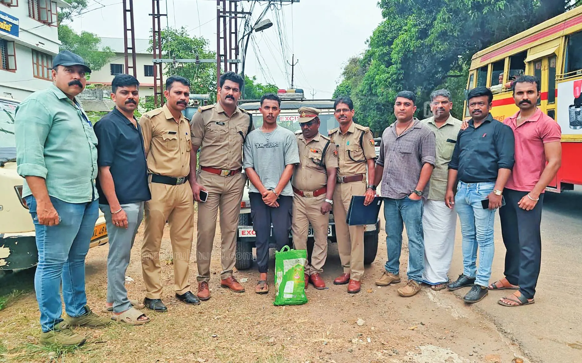 Kerala excise officers seizing hashish oil from a milk van during a drug bust in Thrissur