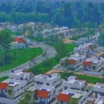 DYFI protest banner over delay in Congress housing project for Mundakkai rehabilitation in Wayanad