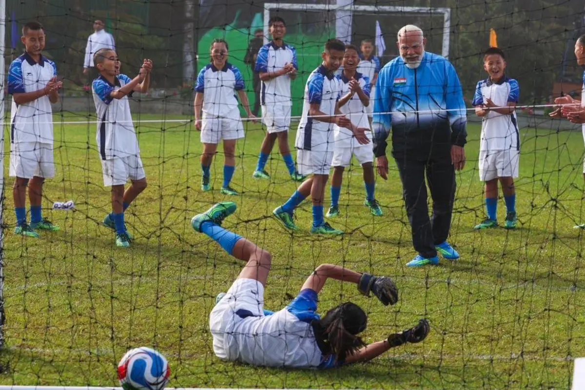Prime Minister Narendra Modi playing football with children during Sikkim statehood celebrations