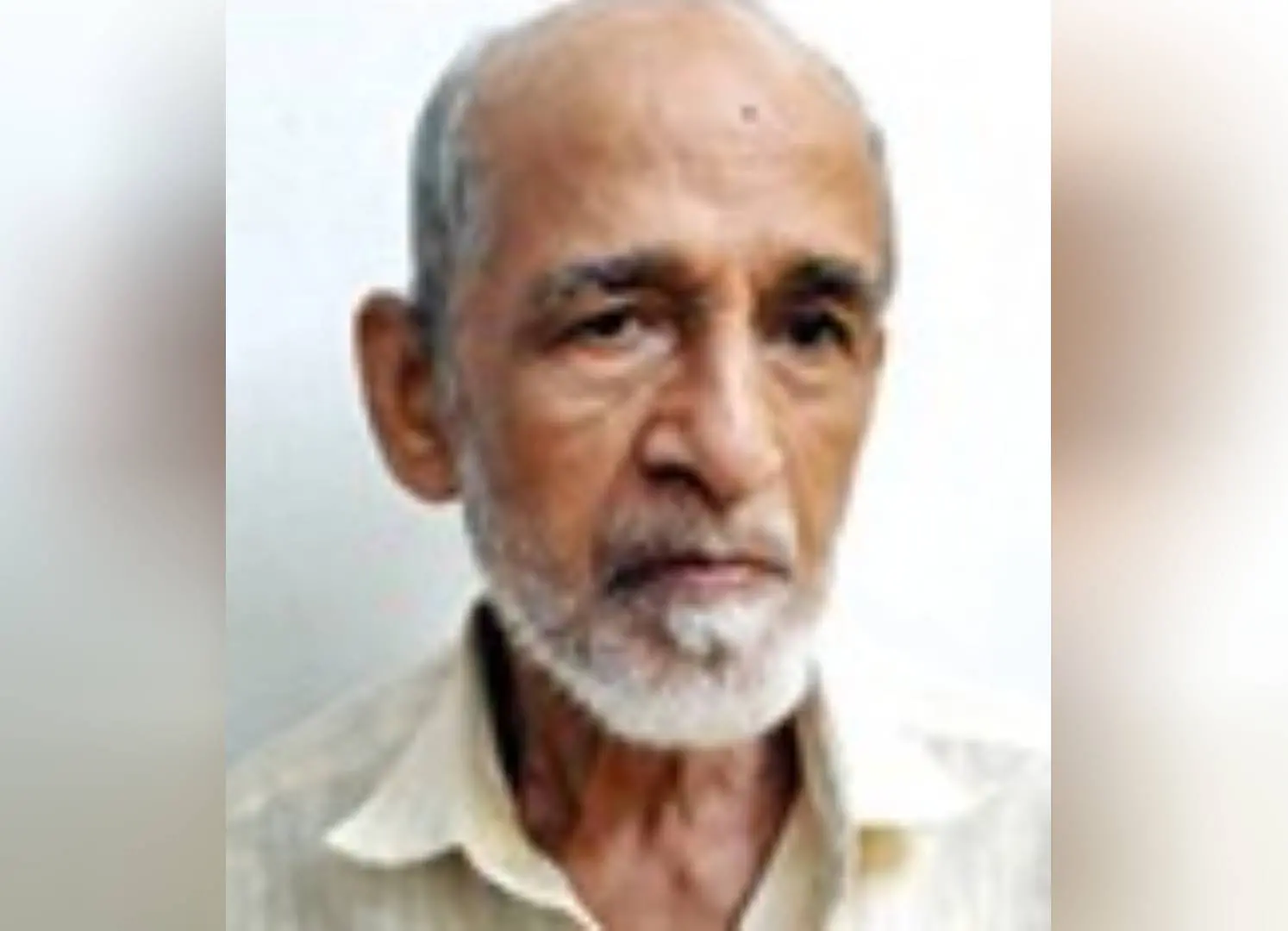 Police arresting elderly man in Erattupetta after domestic violence attack involving pressure cooker