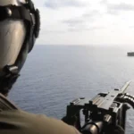 US naval forces intercepting cargo ship near Iranian waters during escalating maritime conflict