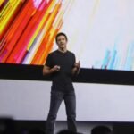 John Ternus presenting Apple products during a company event showcasing new technology developments