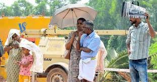 People walking under intense sun in Kerala during severe heat wave and high temperature conditions