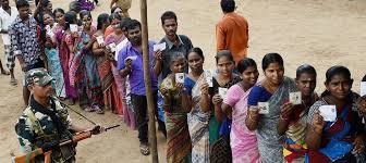 Voters standing in long queues at polling booths in Tamil Nadu during high turnout election day