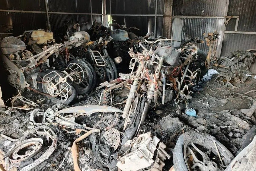 Fire accident at bike workshop near Mangalam bridge with burnt motorcycles and fire brigade operation