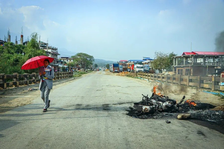 Burned houses and security forces deployed after violence in Manipur villages