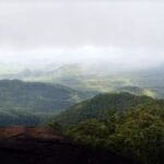 Fireforce and police rescuing stranded trekkers from Koranappara hill in Kozhikode at night