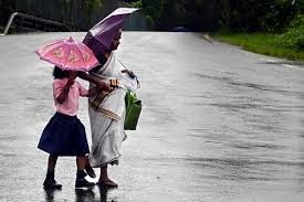 Dark clouds over Kerala indicating heavy summer rain with yellow alert warning issued