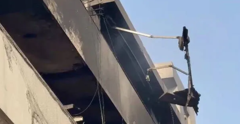 Firefighters rescuing people from building fire in Delhi Vivek Vihar