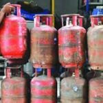 Commercial LPG gas cylinders stacked outside a restaurant kitchen