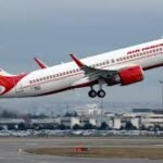Air India aircraft on runway with cancellations notice affecting multiple flights