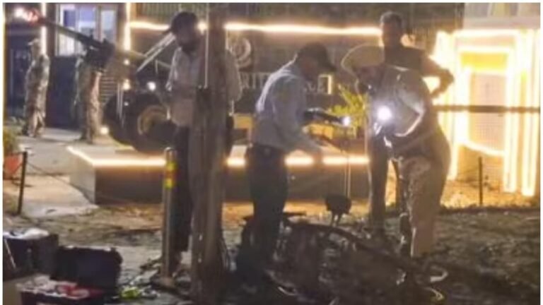 Explosion site in Punjab with damaged vehicle and security personnel investigating