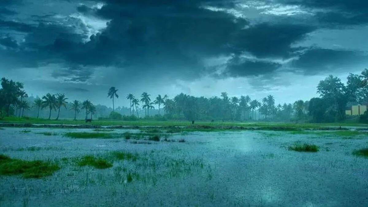 Kerala Rain Alert showing heavy rain clouds over Kerala with yellow alert